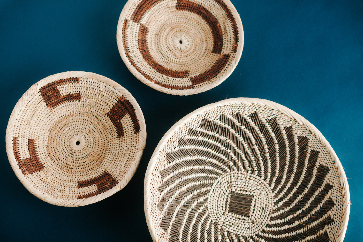 hand-woven tonga baskets on a blue background