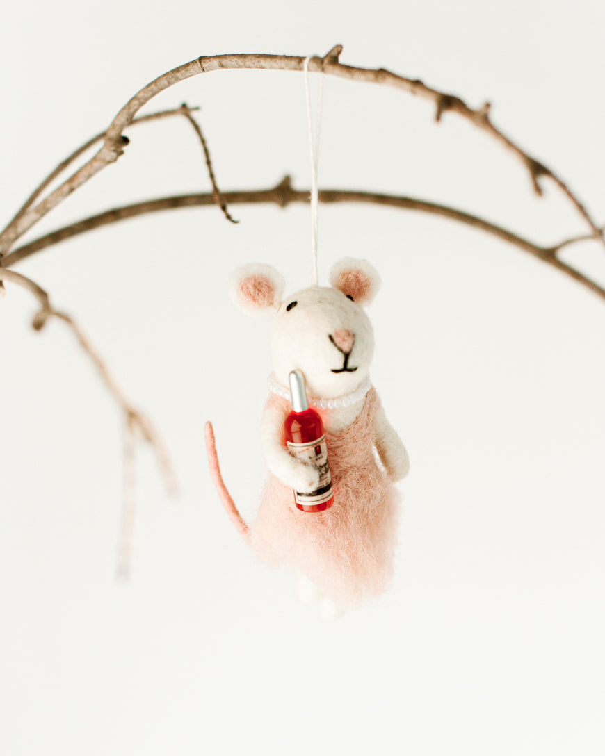 Felt Ballerina Mouse and Soldier Mouse ornaments on a beige background