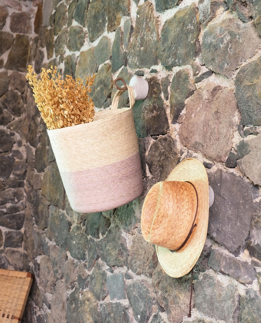 hanging basket on stone wall
