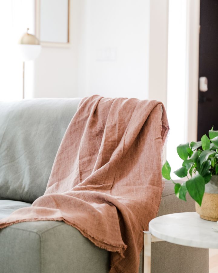 ash rose stone washed linen throw blanket hanging on couch, wholesale luxury cotton bed blanket, cotton blanket queen, cotton blankets, cotton blankets and throws, cotton king blanket, cotton woven blanket, infant cotton blanket, organic cotton blanket, organic throw blanket, woven throw blanket